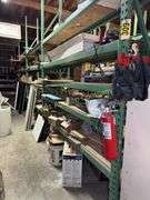 Warehouse shelving with contents (3 rows) 96' (not including metal pipe) buyer responsible for disassembly and removal