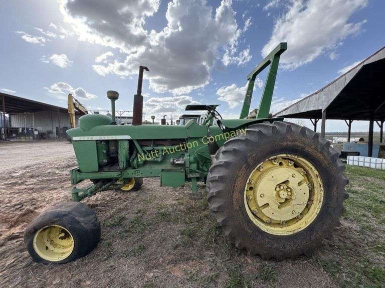 John Deere tractor. For parts of repair. Condition unknown.