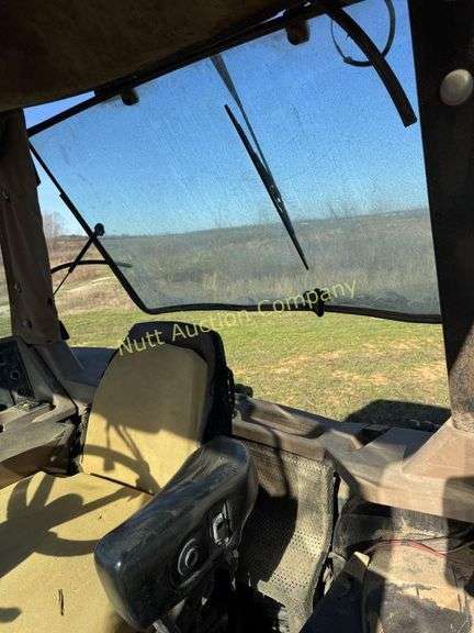 John Deere 8300 Tractor with duals Showing 1410 hours.  200 HP, 4WD, 403.6 hours showing, rear duals, front weights, 3 set of