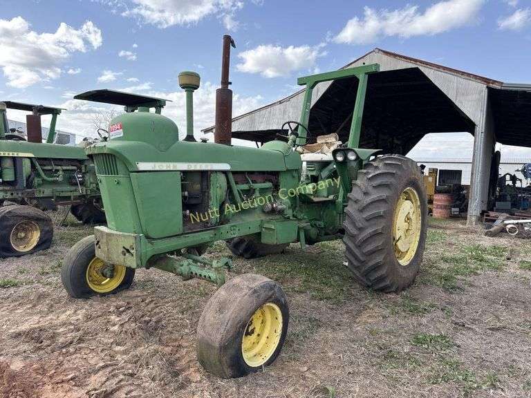 John Deere tractor. For parts of repair. Condition unknown.