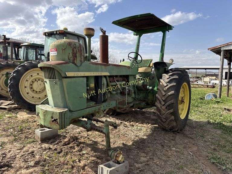 John Deere tractor. For parts of repair. Condition unknown.