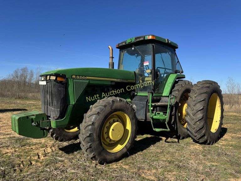 John Deere 8300 Tractor with duals Showing 1410 hours.  200 HP, 4WD, 403.6 hours showing, rear duals, front weights, 3 set of