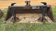 Quick attach skid steer bucket with quick hitch built in