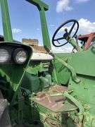 John Deere tractor. For parts of repair. Condition unknown.