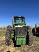 John Deere 8300 Tractor with duals Showing 1410 hours.  200 HP, 4WD, 403.6 hours showing, rear duals, front weights, 3 set of