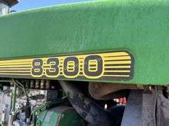 John Deere 8300 Tractor with duals Showing 1410 hours.  200 HP, 4WD, 403.6 hours showing, rear duals, front weights, 3 set of