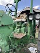 John Deere tractor. For parts of repair. Condition unknown.