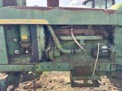John Deere tractor. For parts of repair. Condition unknown.