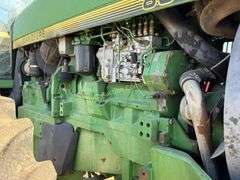 John Deere 8300 Tractor with duals Showing 1410 hours.  200 HP, 4WD, 403.6 hours showing, rear duals, front weights, 3 set of