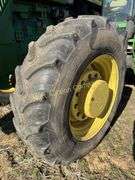John Deere 8300 Tractor with duals Showing 1410 hours.  200 HP, 4WD, 403.6 hours showing, rear duals, front weights, 3 set of