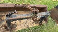 Quick attach skid steer bucket with quick hitch built in