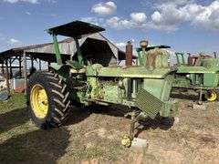 John Deere tractor. For parts of repair. Condition unknown.