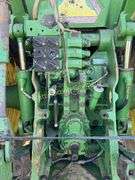John Deere 8300 Tractor with duals Showing 1410 hours.  200 HP, 4WD, 403.6 hours showing, rear duals, front weights, 3 set of