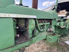 John Deere tractor. For parts of repair. Condition unknown.