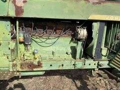 John Deere tractor. For parts of repair. Condition unknown.