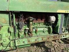 John Deere tractor. For parts or repair only. Condition unknown.