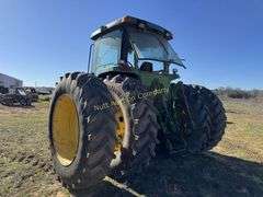 John Deere 8300 Tractor with duals Showing 1410 hours.  200 HP, 4WD, 403.6 hours showing, rear duals, front weights, 3 set of