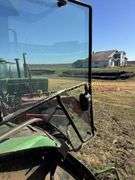 John Deere 8300 Tractor with duals Showing 1410 hours.  200 HP, 4WD, 403.6 hours showing, rear duals, front weights, 3 set of