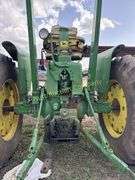 John Deere tractor. For parts of repair. Condition unknown.