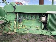 John Deere tractor. For parts of repair. Condition unknown.