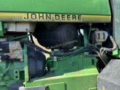 John Deere 8300 Tractor with duals Showing 1410 hours.  200 HP, 4WD, 403.6 hours showing, rear duals, front weights, 3 set of