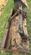 Quick attach skid steer bucket with quick hitch built in