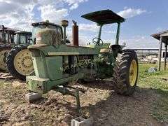 John Deere tractor. For parts of repair. Condition unknown.