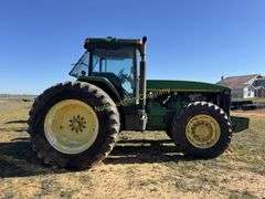 John Deere 8300 Tractor with duals Showing 1410 hours.  200 HP, 4WD, 403.6 hours showing, rear duals, front weights, 3 set of