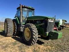 John Deere 8300 Tractor with duals Showing 1410 hours.  200 HP, 4WD, 403.6 hours showing, rear duals, front weights, 3 set of