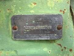 John Deere tractor. For parts of repair. Condition unknown.
