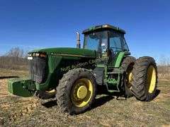 John Deere 8300 Tractor with duals Showing 1410 hours.  200 HP, 4WD, 403.6 hours showing, rear duals, front weights, 3 set of