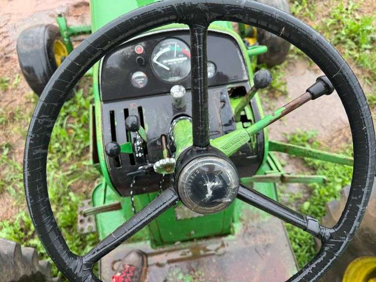 John Deere tractor. For parts of repair. Condition unknown.
