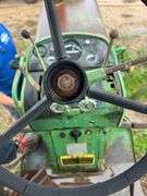 John Deere tractor. For parts of repair. Condition unknown.