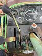 John Deere tractor. For parts of repair. Condition unknown.