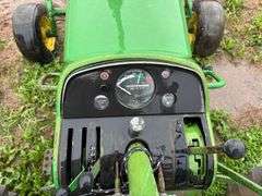 John Deere tractor. For parts of repair. Condition unknown.