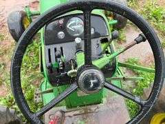 John Deere tractor. For parts of repair. Condition unknown.