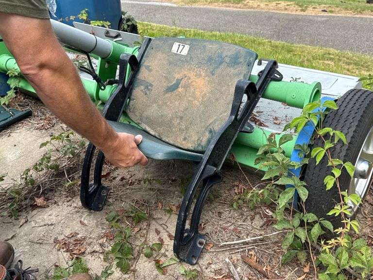 Stadium Seats, Green and Black, Floor Mount.  Quantity unknown.  No hardware (nuts or bolts)