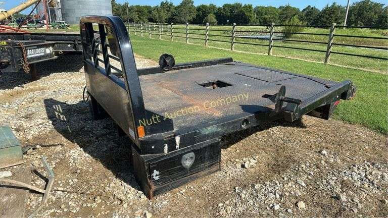 CM Truck Beds RD Model Flatbed, equipped with hydraulic bale lift. Steel, 9'4" x 94"