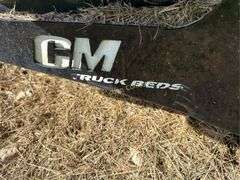 CM Truck Beds RD Model Flatbed, equipped with hydraulic bale lift. Steel, 9'4" x 94"