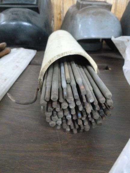 Group Of Welding Rods / Welding Helmets