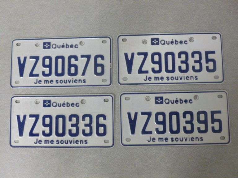 (4) Quebec License Plates