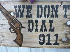 We Don't Dial 911 Wooden Sign - 9.5" x 16"