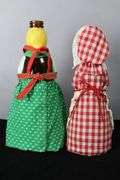 PAINTED AUNT JEMIMA BOTTLES, WITH HAND MADE CLOTHING
