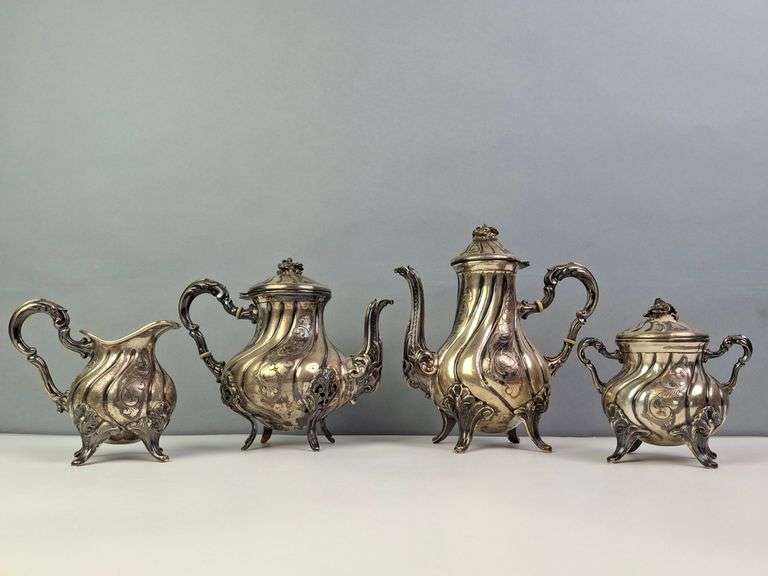 VICTORIAN STERLING SILVER TEA SET, WITH SCROLLING ACANTHUS LEAF DESING AND FLORAL CLUSTER FINIALS, 1