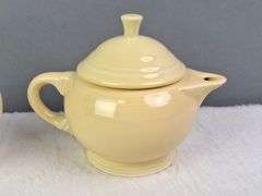 SMALL YELLOW TEA SET, HOMER LAUGHLIN CA, LIDDED TEAPOT, LIDDED SUGAR, AND CREAMER.