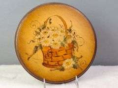 ROUND WOODEN PLAQUE WITH A HAND-PAINTED BASKET FILLED WITH DAISIES, SIGNED FRAN '75, 9.5"W.