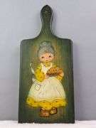 HAND PAINTED VINTAGE WOODEN BREAD BOARD, GRANDMA WITH HOMEMADE PIE, SIGNED FRAN '74, 13" X 6.75".