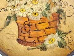 ROUND WOODEN PLAQUE WITH A HAND-PAINTED BASKET FILLED WITH DAISIES, SIGNED FRAN '75, 9.5"W.