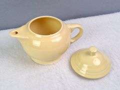SMALL YELLOW TEA SET, HOMER LAUGHLIN CA, LIDDED TEAPOT, LIDDED SUGAR, AND CREAMER.