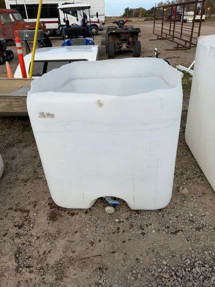 Tote with top cut off, great for storing wood.